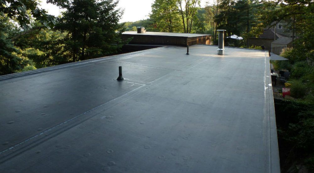This is what a EPDM rubber roof looks like. It is smooth and have less seams. They often need repairs. New Canaan, Westport, Connecticut Flat Roof repairs - This is what a EPDM rubber roof looks like. It is smooth and have less seams. They often need repairs. New Canaan, Westport, Connecticut