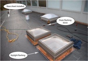 The roof is ready to receive the final membrane. Notice that the base sheet is under the flashing. The roof is ready to receive the final membrane. Notice that the base sheet is under the flashing.