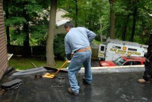 This EPDM roof was leaking and caused the insulation underneath to curl up. This EPDM roof was leaking and caused the insulation underneath to curl up.