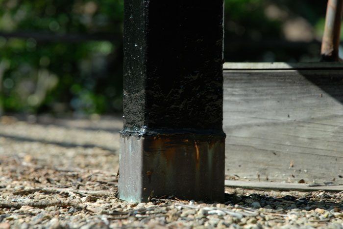 This post on a flat roof have no sleeve. You will notice where the flashing ends is caulking. That is where the water gets in. This post on a flat roof have no sleeve. You will notice where the flashing ends is caulking. That is where the water gets in.
