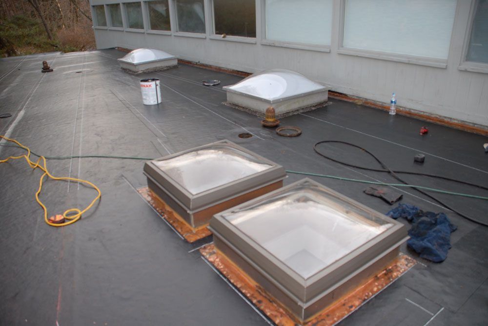 Flashing on the walls and skylights - the base liner is in Flashing on the walls and skylights - the base liner is installed and flashing is ready to receive new roof