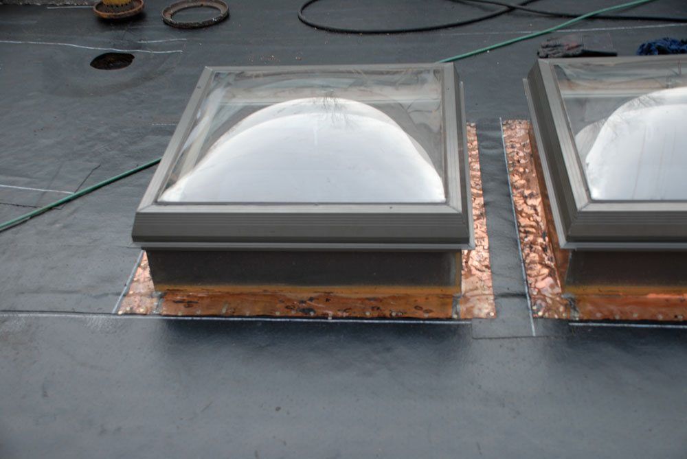 These skylights had the flashing cleaned before a new roof could be installed