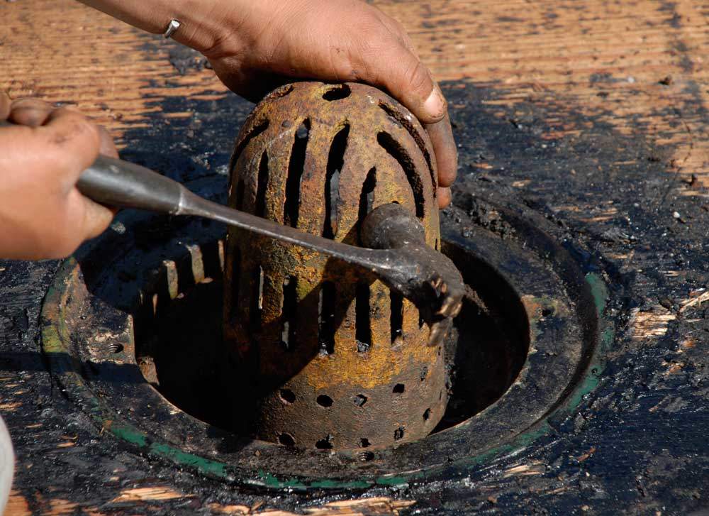 Old Fashioned flat roof Drain Strainer This is a cast iron flat roof drain strainer. This was a badly designed drain strainer due to the small openings