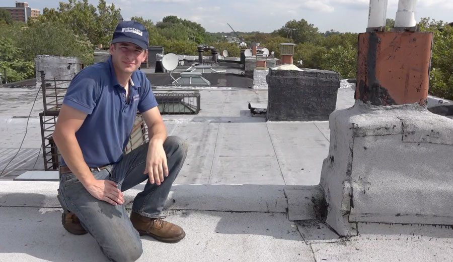 A Brownstone chimney is wrapped with rubber roof membrane. A Brownstone chimney is wrapped with rubber roof membrane.
