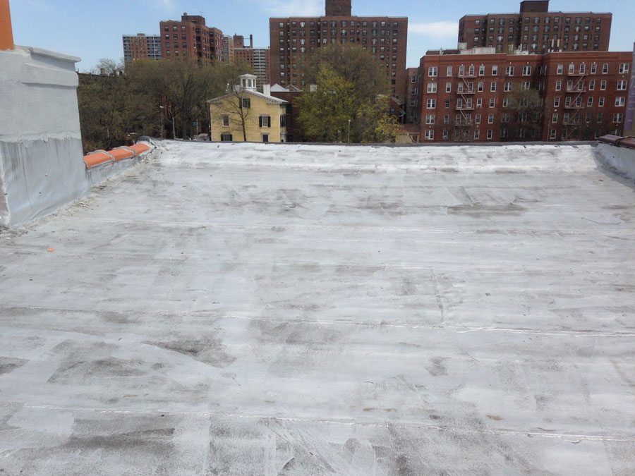 A Modified Bitumen Torch Down Rubber Roof with Aluminum Asphalt coating (silver paint) A Modified Bitumen Torch Down Rubber Roof with Aluminum Asphalt coating (silver paint)